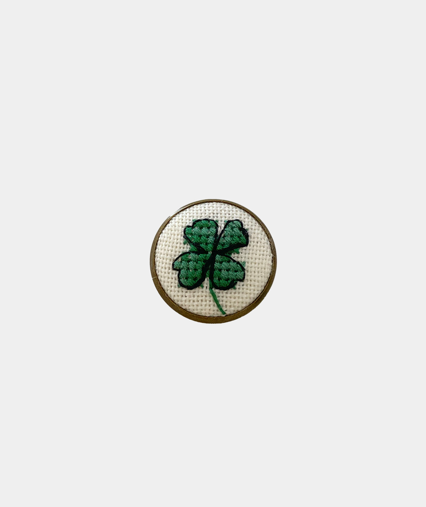 Four-leaf clover badge